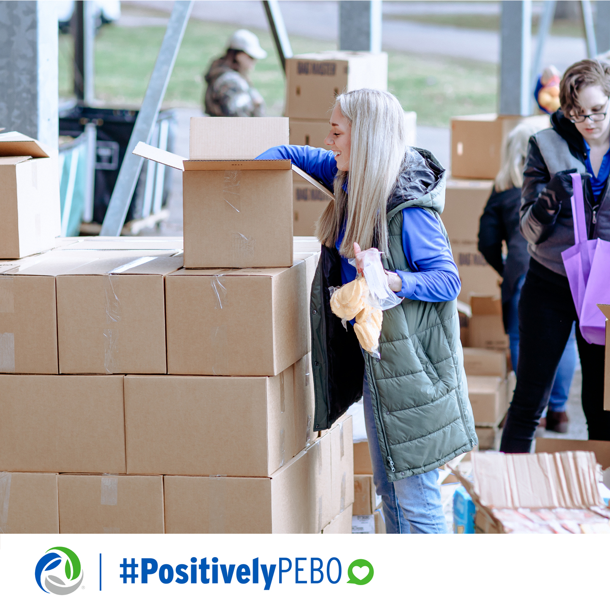 Showcasing the many different ways we are #positivelyPEBO with woman packing boxes