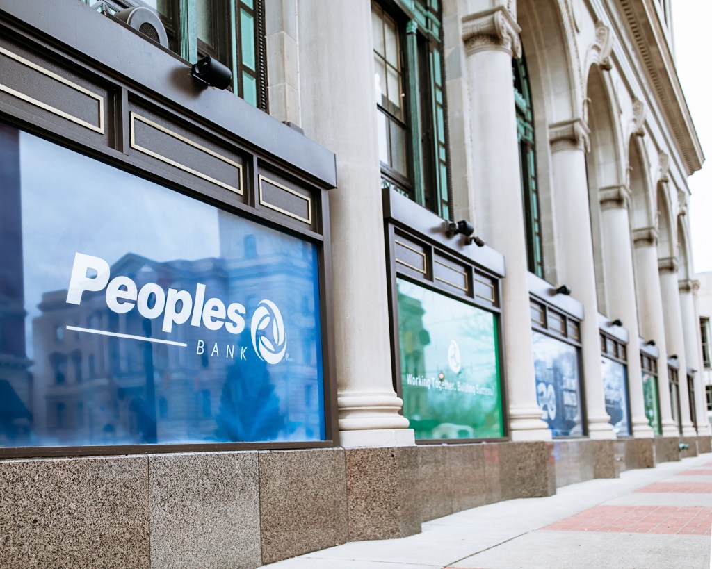 Peoples Bank headquarters with glass windows.