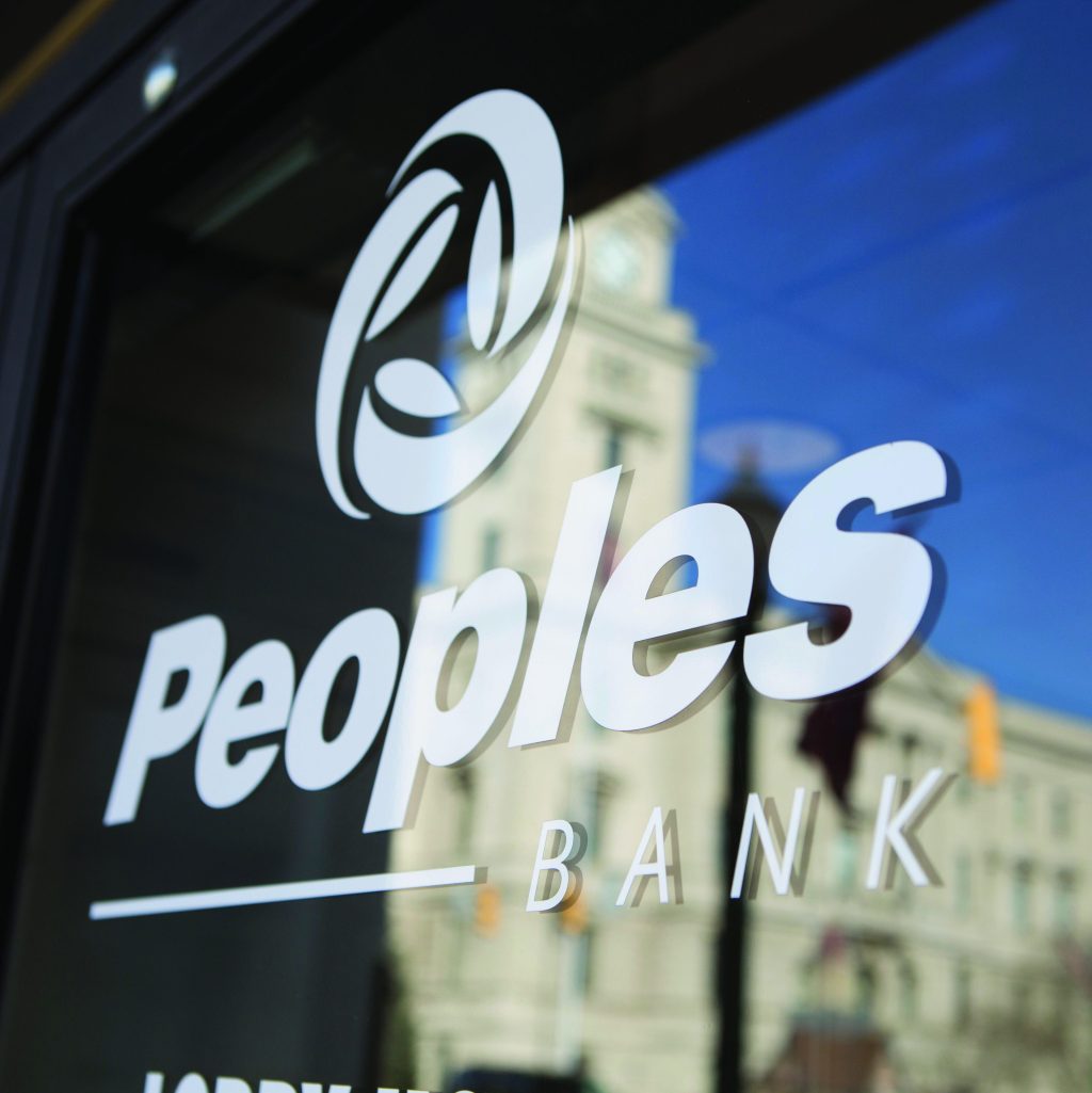 Peoples Bank logo on a glass window.