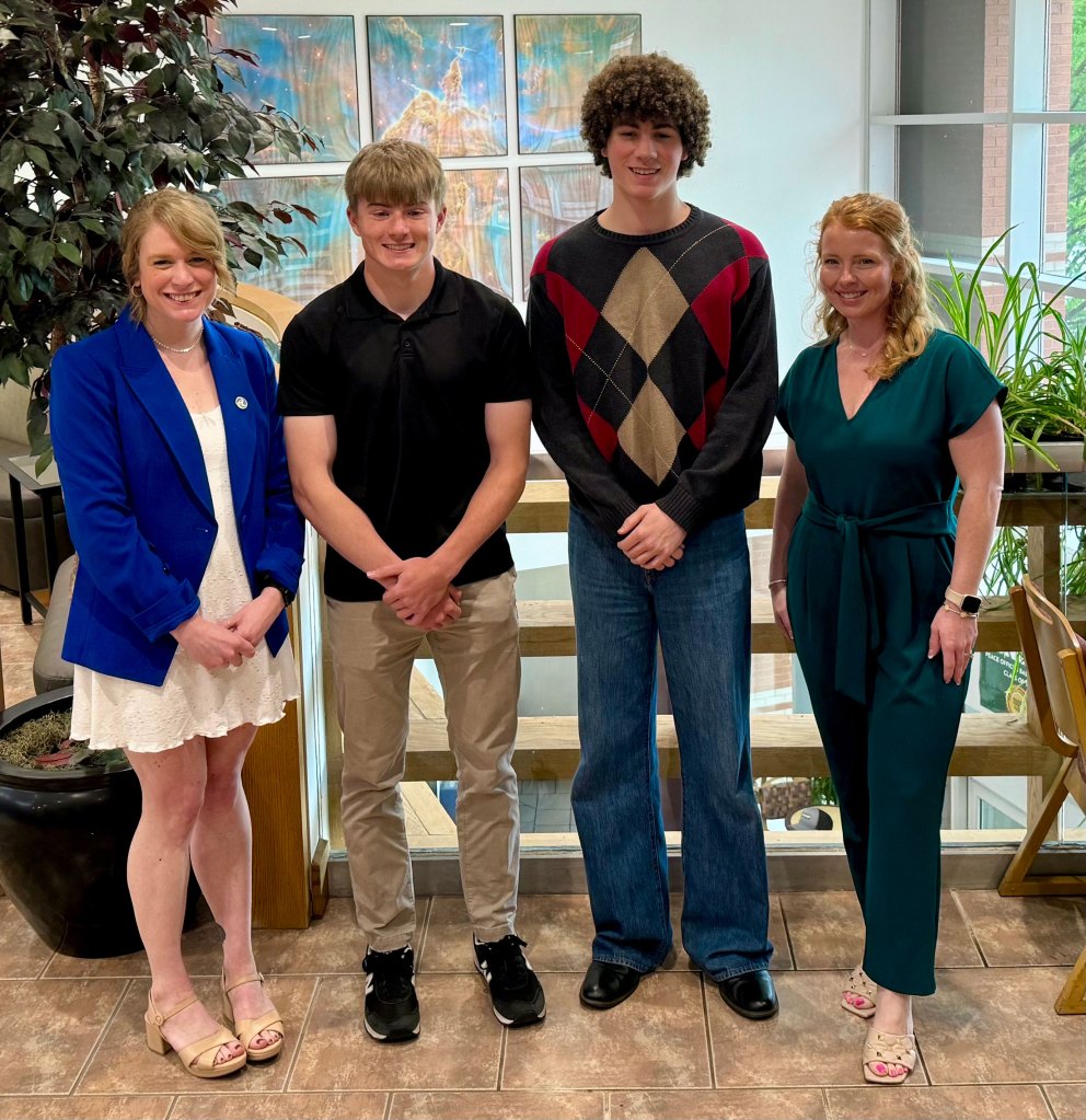 Two Peoples Bank associates present scholarships to the two 2025 winners.