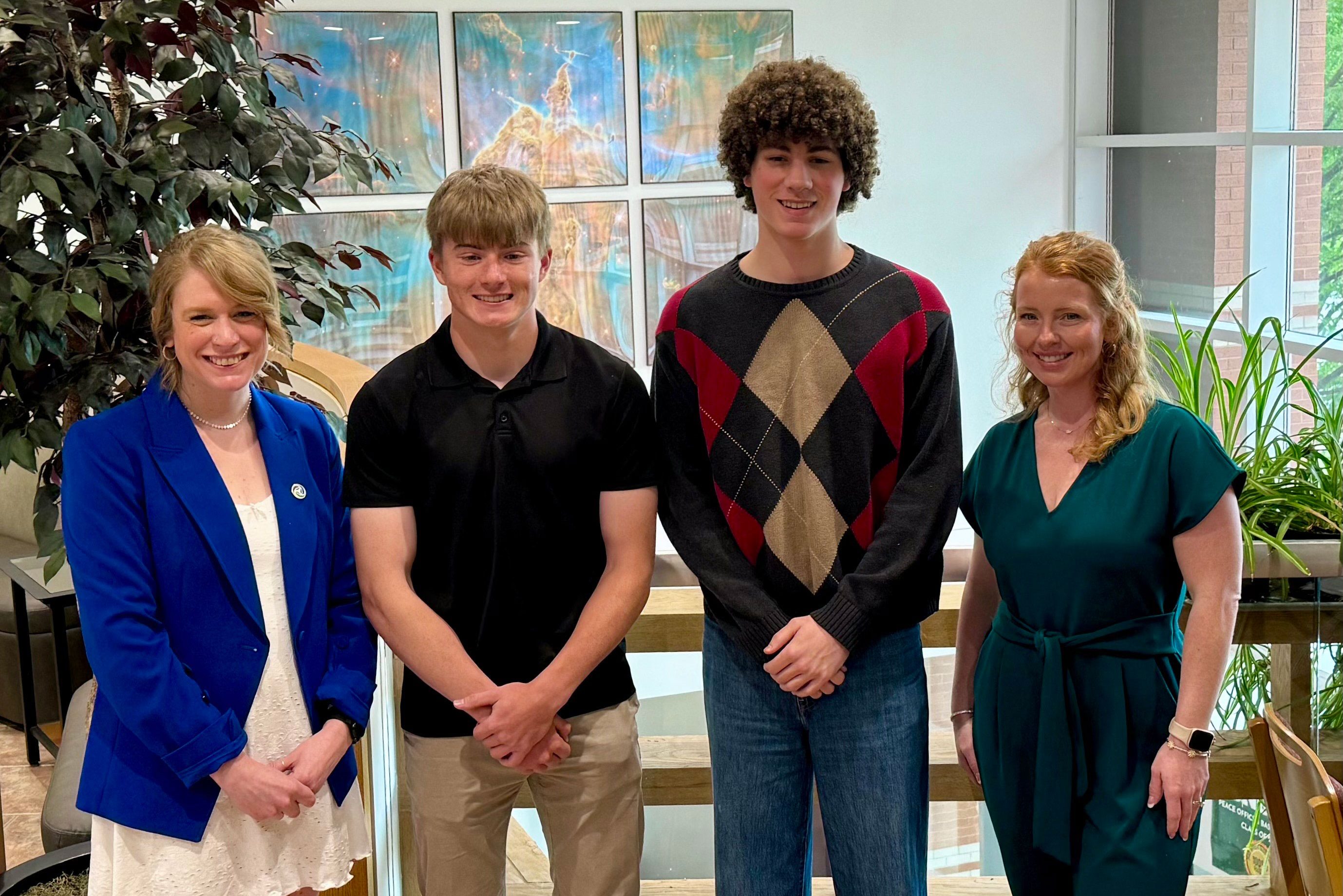 Two Peoples Bank associates present scholarships to the two 2025 winners.