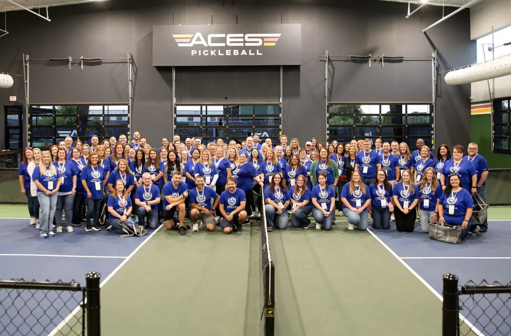 Over 100 Peoples Bank associates pose for a photo at Aces Pickleball in Cincinnati Ohio, where the fall 2025 President's Club event was held.
