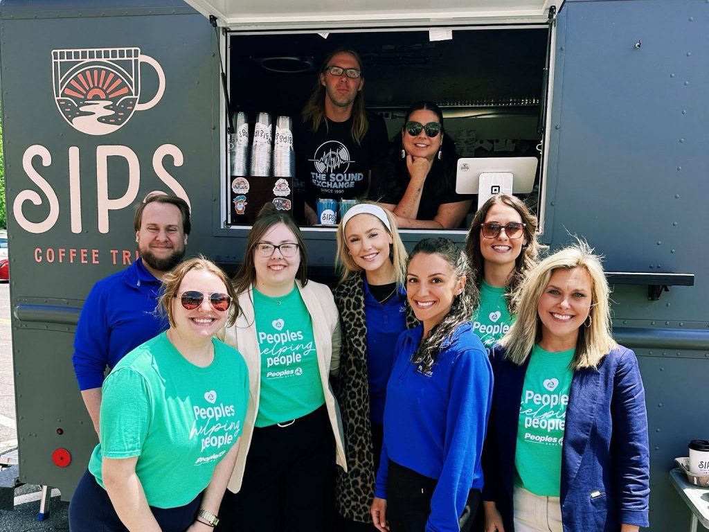 Eight SIPS Coffee Truck and Peoples Bank associates stand in front of the coffee truck as they prepare for Teacher Appreciation Week in Marietta, Ohio.