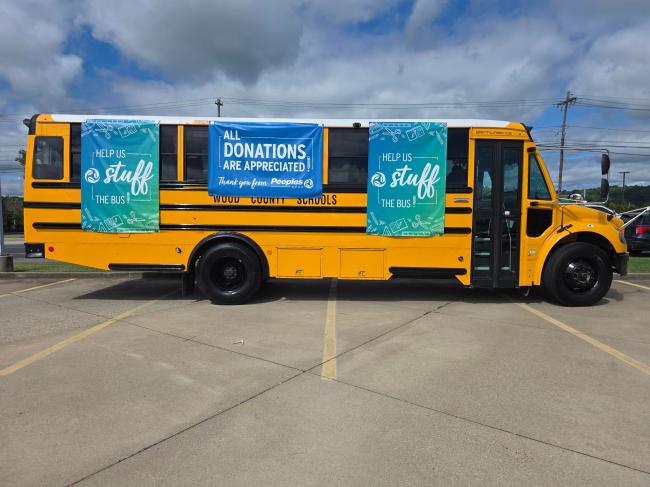 A school bus parked in front of the Peoples Bank Vienna, WV, branch accepting school supply donations.