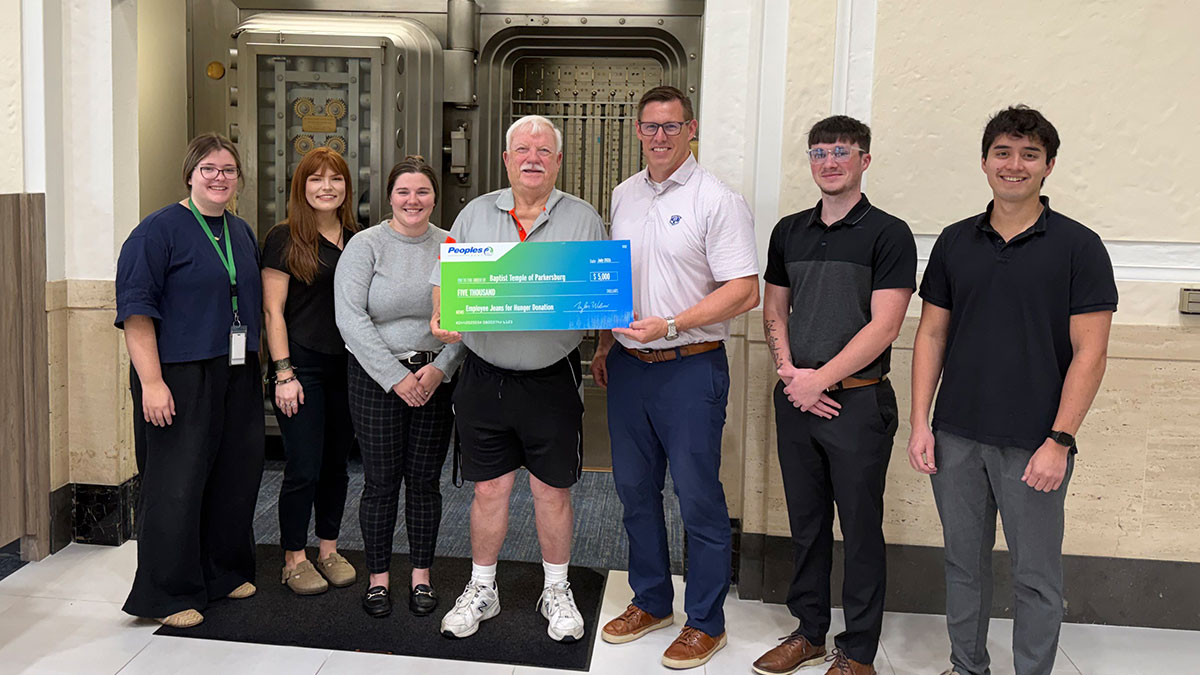 Six Peoples Bank associates present a check to the Baptist Temple of Parkersburg in West Virginia.